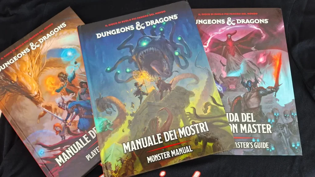 Manuale dei Mostri di D&D 2024 assieme a DMG e MdG